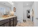 Bathroom featuring granite counters, dark cabinets, tile flooring and modern fixtures at 1106 Tarpon Pond Rd., North Myrtle Beach, SC 29582