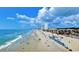Scenic beach with ocean views, beachgoers, clear skies, and buildings in the background at 1106 Tarpon Pond Rd., North Myrtle Beach, SC 29582
