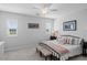Well-lit bedroom with neutral walls, shuttered windows, soft carpet and comfortable furnishings at 1106 Tarpon Pond Rd., North Myrtle Beach, SC 29582