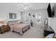 Well-lit bedroom with soft carpet, shuttered windows, comfortable bed, and ample lighting at 1106 Tarpon Pond Rd., North Myrtle Beach, SC 29582