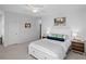 Spacious bedroom features a white bedframe, nightstands, ceiling fan, and neutral-toned walls at 1106 Tarpon Pond Rd., North Myrtle Beach, SC 29582