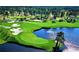 Panoramic aerial view of a lush golf course with sand traps and a tranquil pond surrounded by trees at 1106 Tarpon Pond Rd., North Myrtle Beach, SC 29582