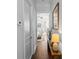 Hallway with hardwood flooring and a view into a bedroom and bathroom at 1106 Tarpon Pond Rd., North Myrtle Beach, SC 29582