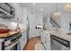 Contemporary kitchen with stainless steel appliances, granite countertops, and an island with a farmhouse sink at 1106 Tarpon Pond Rd., North Myrtle Beach, SC 29582