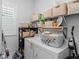Bright laundry room with washer and dryer and ample storage space at 1106 Tarpon Pond Rd., North Myrtle Beach, SC 29582