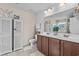 Bathroom with double vanity, tile floor, and white storage cabinets at 1189 Wyatt Ln., Myrtle Beach, SC 29577