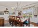 Inviting dining room with a large table, chandelier and stylish decor, great for gatherings at 1189 Wyatt Ln., Myrtle Beach, SC 29577