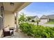 Inviting front porch view of street with chair, landscaping, and cozy curb appeal in a quiet neighborhood at 1189 Wyatt Ln., Myrtle Beach, SC 29577