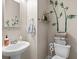 Bright powder room with pedestal sink and decorative wall art at 1189 Wyatt Ln., Myrtle Beach, SC 29577
