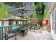 Outdoor deck features seating with an umbrella, with outdoor building features at 1205 King St., Myrtle Beach, SC 29577