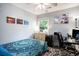 Cozy bedroom includes a ceiling fan, desk and bright window at 1205 King St., Myrtle Beach, SC 29577