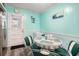 Eat-in kitchen with aqua walls, laminate flooring and vintage style furnishings at 1205 King St., Myrtle Beach, SC 29577