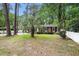 Exterior view of a brick home with a well-maintained lawn and a palm tree at 1205 King St., Myrtle Beach, SC 29577