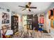 Eclectic living room featuring guitars, a ceiling fan, and a view into the kitchen at 1205 King St., Myrtle Beach, SC 29577