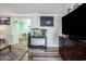 Living room view of entertainment center, fish tank, and open doorway at 1205 King St., Myrtle Beach, SC 29577