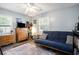 Relaxing living room offers a futon, dresser, and lots of natural light at 1205 King St., Myrtle Beach, SC 29577