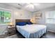 Comfortable main bedroom featuring a ceiling fan, wood-look floors, and natural light at 1205 King St., Myrtle Beach, SC 29577