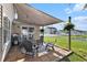 Cozy backyard patio featuring stylish furniture and overhead shade for outdoor relaxation at 1209 Eagle Creek Dr., Myrtle Beach, SC 29588