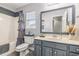 Traditional bathroom featuring a gray vanity, neutral countertop, and shower-tub combo at 1209 Eagle Creek Dr., Myrtle Beach, SC 29588