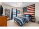 Cozy bedroom with lake view, a large window, Americana-themed wall art, and stylish furnishings at 1209 Eagle Creek Dr., Myrtle Beach, SC 29588
