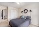 Bright bedroom featuring carpet flooring, ceiling fan, closet, and gray decor at 1209 Eagle Creek Dr., Myrtle Beach, SC 29588