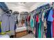 Walk-in closet, offering clothing racks with hanging shirts and jeans at 1209 Eagle Creek Dr., Myrtle Beach, SC 29588