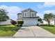 Charming two-story home featuring a two-car garage, well-maintained lawn, and neatly trimmed hedges at 1209 Eagle Creek Dr., Myrtle Beach, SC 29588