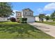 Charming two-story home featuring a two-car garage, well-maintained lawn, and neatly trimmed hedges at 1209 Eagle Creek Dr., Myrtle Beach, SC 29588