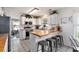 The kitchen features a butcher block island, stainless steel appliances, decorative tile flooring, and white cabinetry at 1209 Eagle Creek Dr., Myrtle Beach, SC 29588
