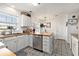 The kitchen features a butcher block island, stainless steel appliances, decorative tile flooring, and white cabinetry at 1209 Eagle Creek Dr., Myrtle Beach, SC 29588