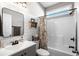 Modern bathroom with shiplap accent wall, updated vanity, and shower-tub combination at 142 Grier Crossing Dr., Conway, SC 29526