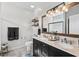 Elegant bathroom with a double vanity, granite countertops, modern lighting and luxury details at 142 Grier Crossing Dr., Conway, SC 29526
