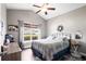 Comfortable bedroom with a large window, ceiling fan, and a work space at 142 Grier Crossing Dr., Conway, SC 29526
