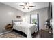 Comfortable bedroom with tufted headboard, bedside tables, and ample natural light at 142 Grier Crossing Dr., Conway, SC 29526