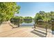 Inviting riverfront boardwalk with benches, perfect for relaxation and enjoying nature views at 142 Grier Crossing Dr., Conway, SC 29526