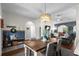 Open dining area featuring a stylish light fixture and views of the living room at 142 Grier Crossing Dr., Conway, SC 29526