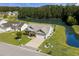 Charming single-story home featuring manicured landscaping and a picturesque waterfront view at 142 Grier Crossing Dr., Conway, SC 29526
