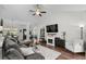 Cozy living room with hardwood floors, a ceiling fan and views into the dining area at 142 Grier Crossing Dr., Conway, SC 29526