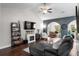 Comfortable living room featuring a fireplace, stylish shelving, and plenty of seating at 142 Grier Crossing Dr., Conway, SC 29526