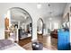 Comfortable living space with dark wood floors, neutral colors, and arched entryways at 142 Grier Crossing Dr., Conway, SC 29526
