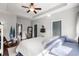 Bright bedroom with white walls, modern decor, a large bed and plenty of natural light at 142 Grier Crossing Dr., Conway, SC 29526
