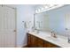 Bathroom with a double sink vanity, large mirror, and neutral tones creating a clean and functional space at 1422 Baldwin Ct. # 1422, Little River, SC 29566