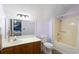 Bathroom with light-tan shower stall, a toilet, and a mirror that reflects the bedroom at 1422 Baldwin Ct. # 1422, Little River, SC 29566
