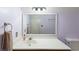 Well-lit bathroom with marble countertops, a mounted mirror, towel rack, and wood cabinets at 1422 Baldwin Ct. # 1422, Little River, SC 29566