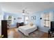 Bright bedroom with hardwood floors, desk, and a comfortable bed with a decorative pillow at 1422 Baldwin Ct. # 1422, Little River, SC 29566