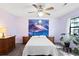 This bedroom boasts unique wall art, neutral walls, two side tables, and a ceiling fan at 1422 Baldwin Ct. # 1422, Little River, SC 29566