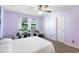 Cozy bedroom with white doors and trim, neutral carpet, and natural light from the window at 1422 Baldwin Ct. # 1422, Little River, SC 29566