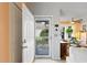Bright entryway with access to a sunlit dining area and outdoor views at 1422 Baldwin Ct. # 1422, Little River, SC 29566