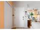 Inviting entryway showcasing hardwood floors and a convenient coat closet at 1422 Baldwin Ct. # 1422, Little River, SC 29566