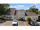 Well-kept exterior showing ample parking and charming curb appeal with tidy landscaping at 1422 Baldwin Ct. # 1422, Little River, SC 29566